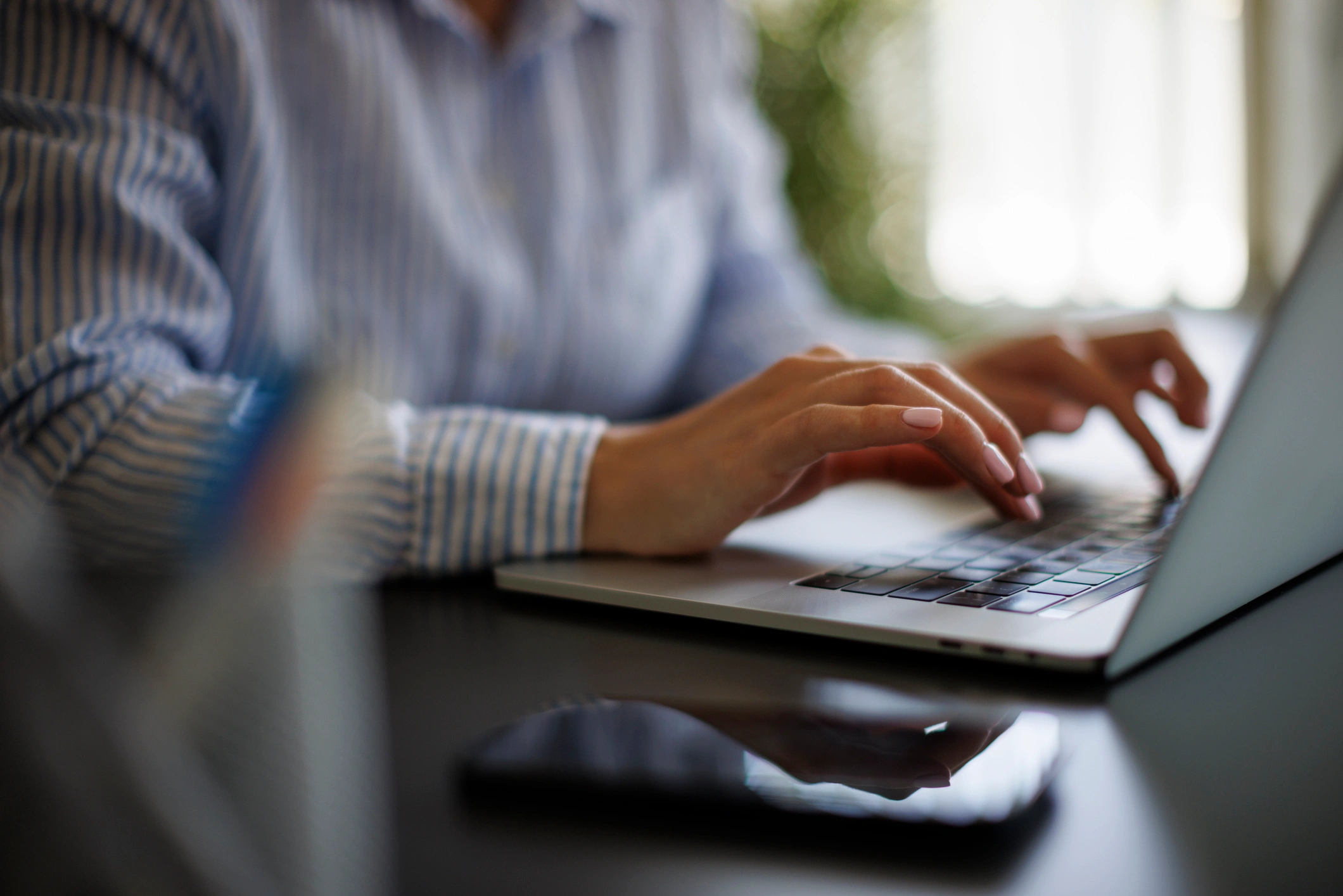 Close-up of woman using laptop computer