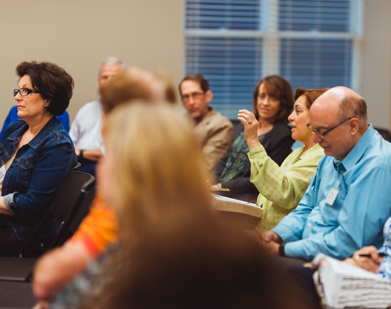 Business professionals in meeting, discussing and engaged in conversation