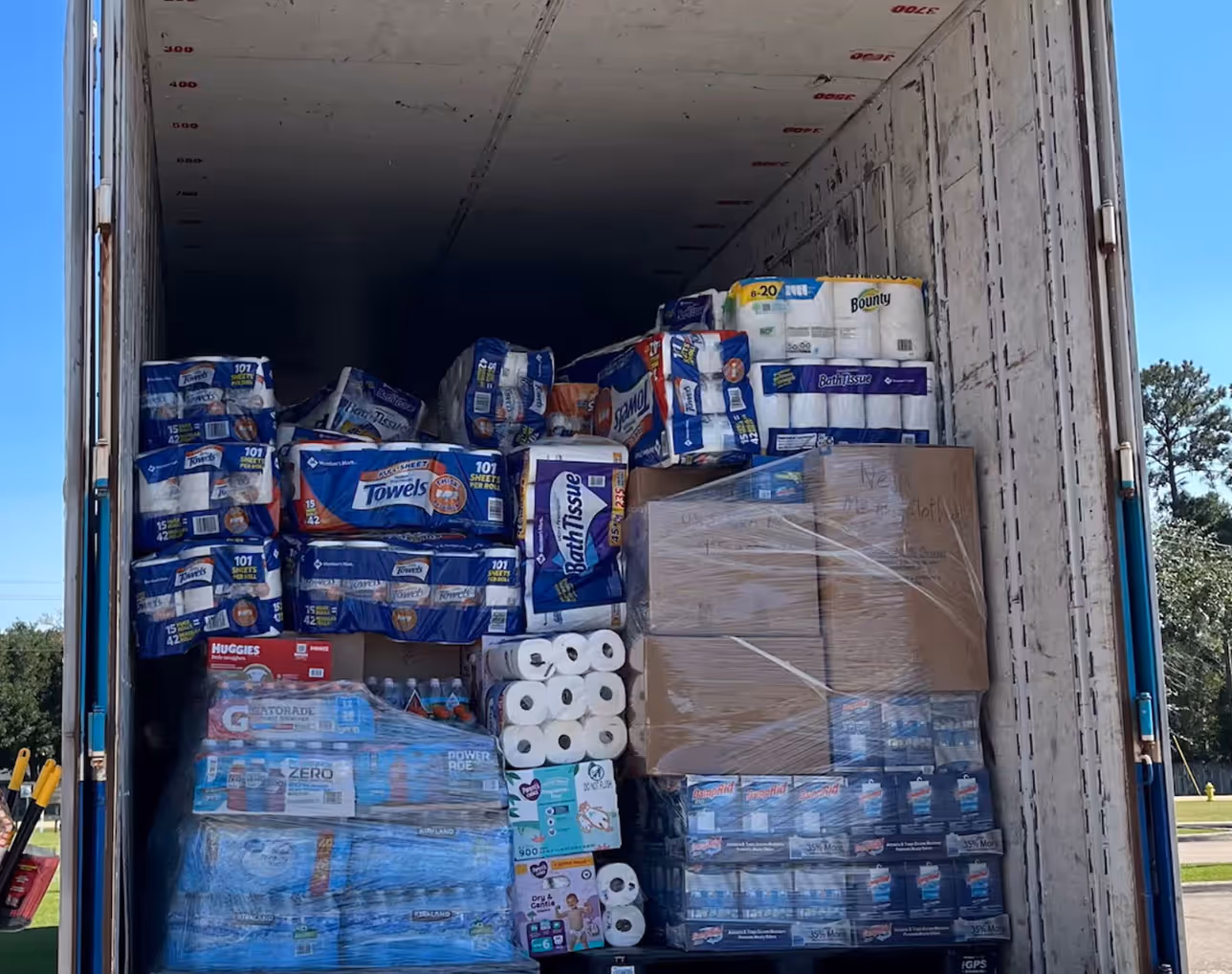 Truck loaded with paper products, paper towels, and cleaning supplies