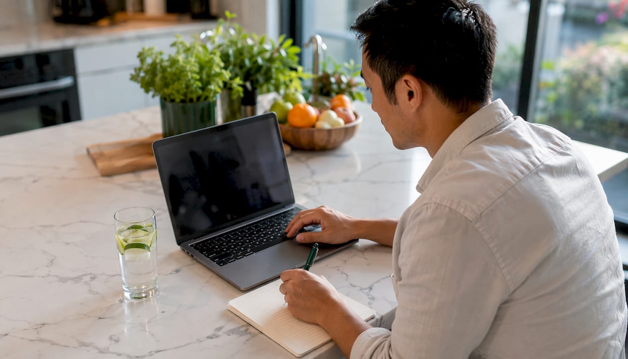 Man in home office during telehealth call