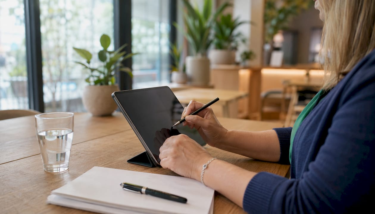Healthcare provider inputting medical data on tablet
