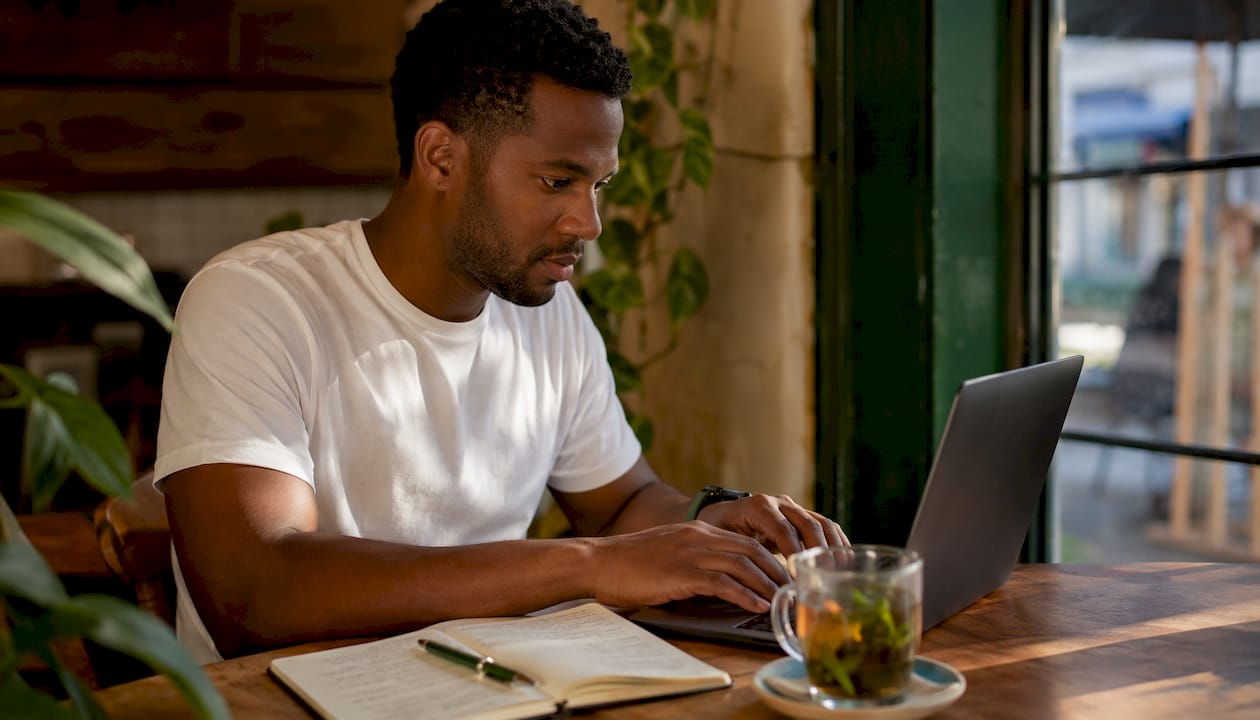 Man using laptop for insurance coverage check