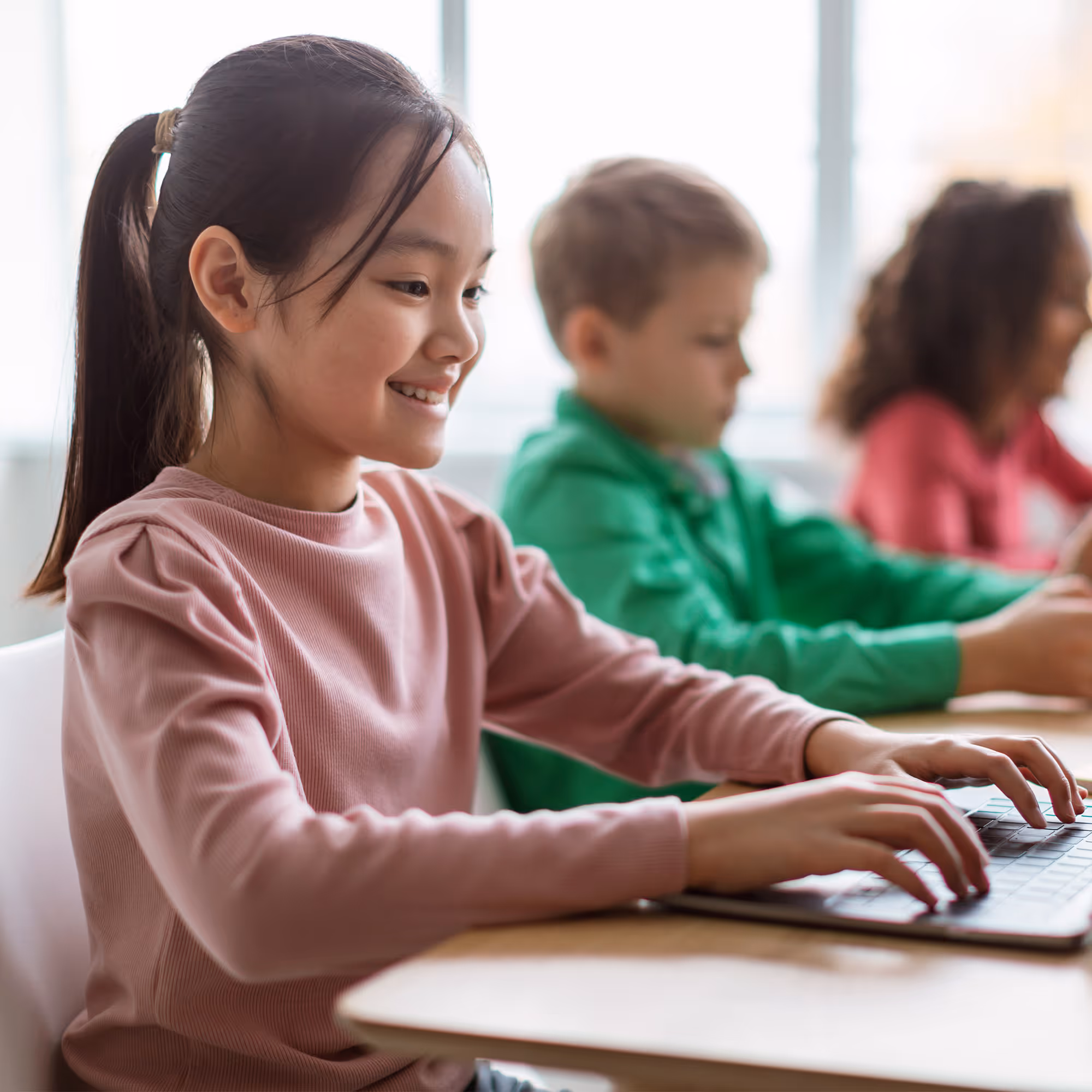 Group of diverse people sitting indoors, smiling and engaging in conversation.