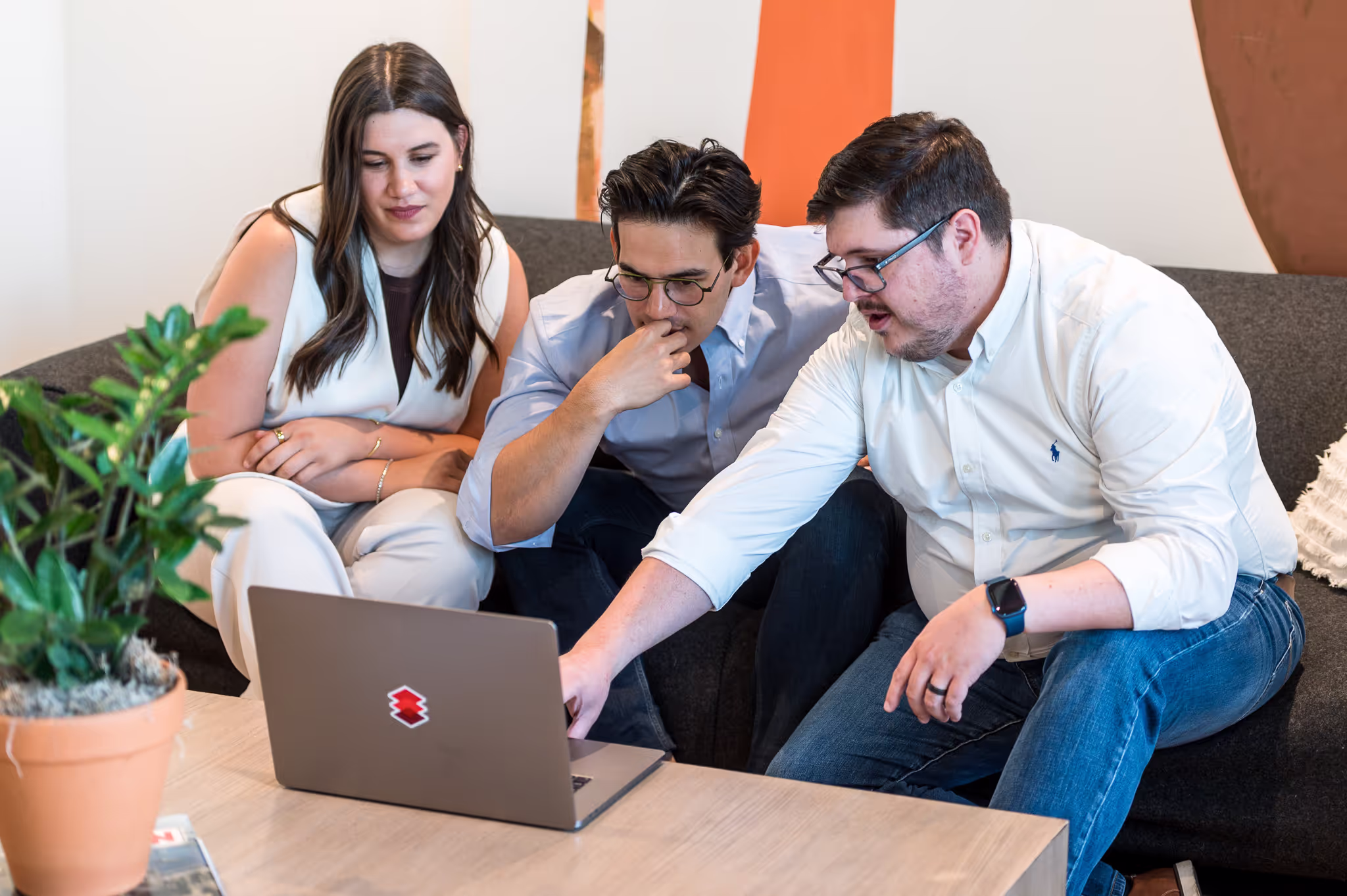 Andrew explaining an issue with the platform UX to two stakeholders