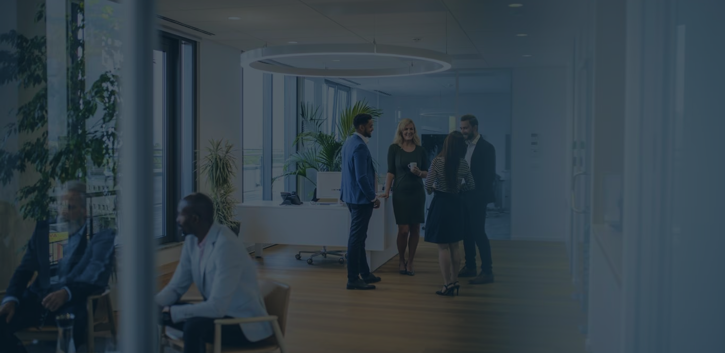 Colleagues talking in a modern office