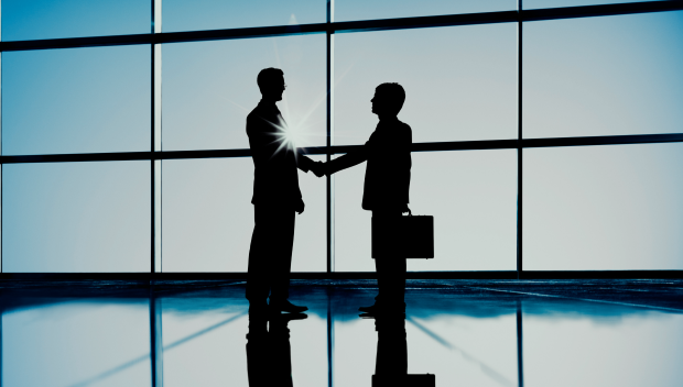 Two business partners shaking hands