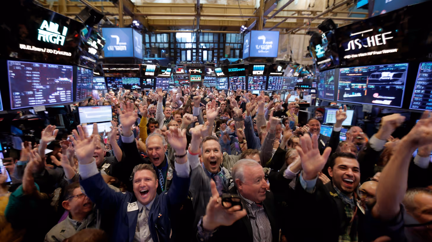 Wall Street traders on the stock exchange floor cheering and raising their hands as market screens display strong gains.