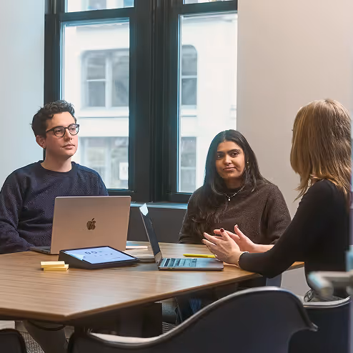 Team members having a meeting in a bright modern office 
