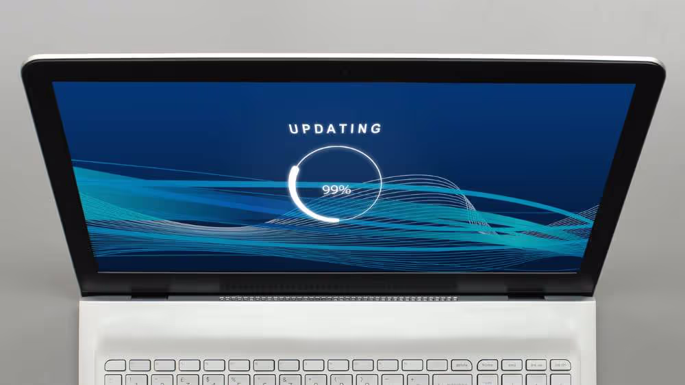 Laptop displaying a software update in progress
