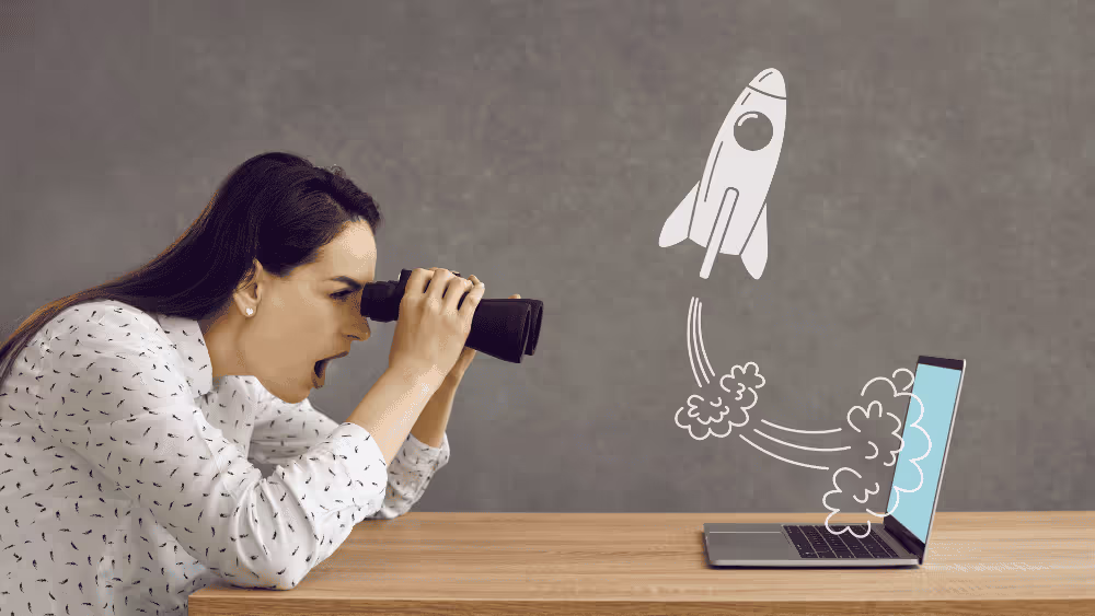 Conceptual illustration of a website launch with a laptop and rocket