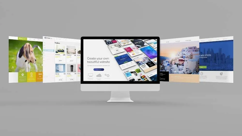 Desktop monitor presenting several website layouts