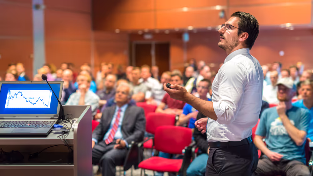 Speaker addressing an audience at an event
