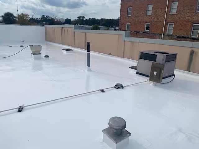 Aerial view of a commercial building with a metal roof in Conway, SC.
