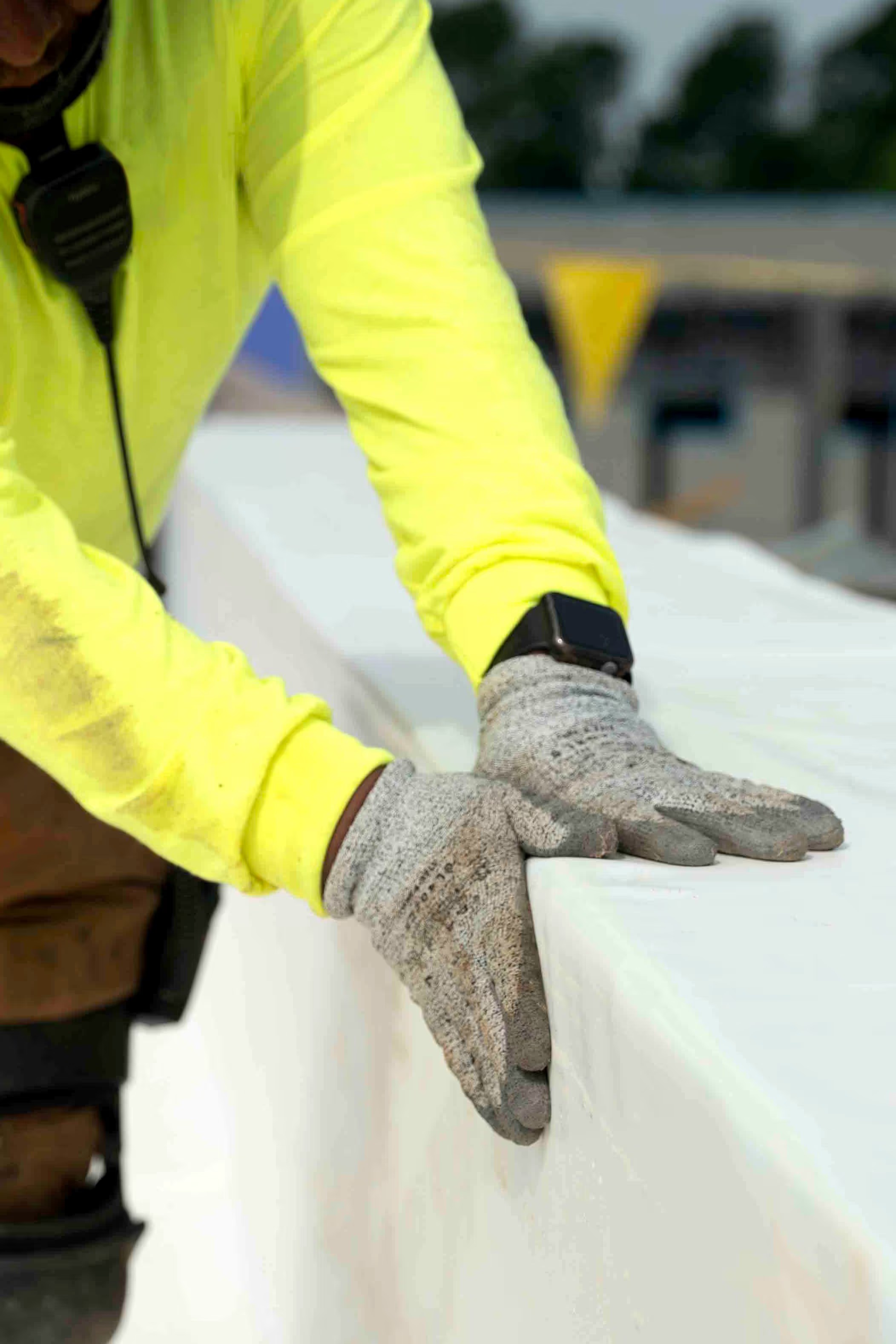 Commercial roof installation crew working on a low-slope building.