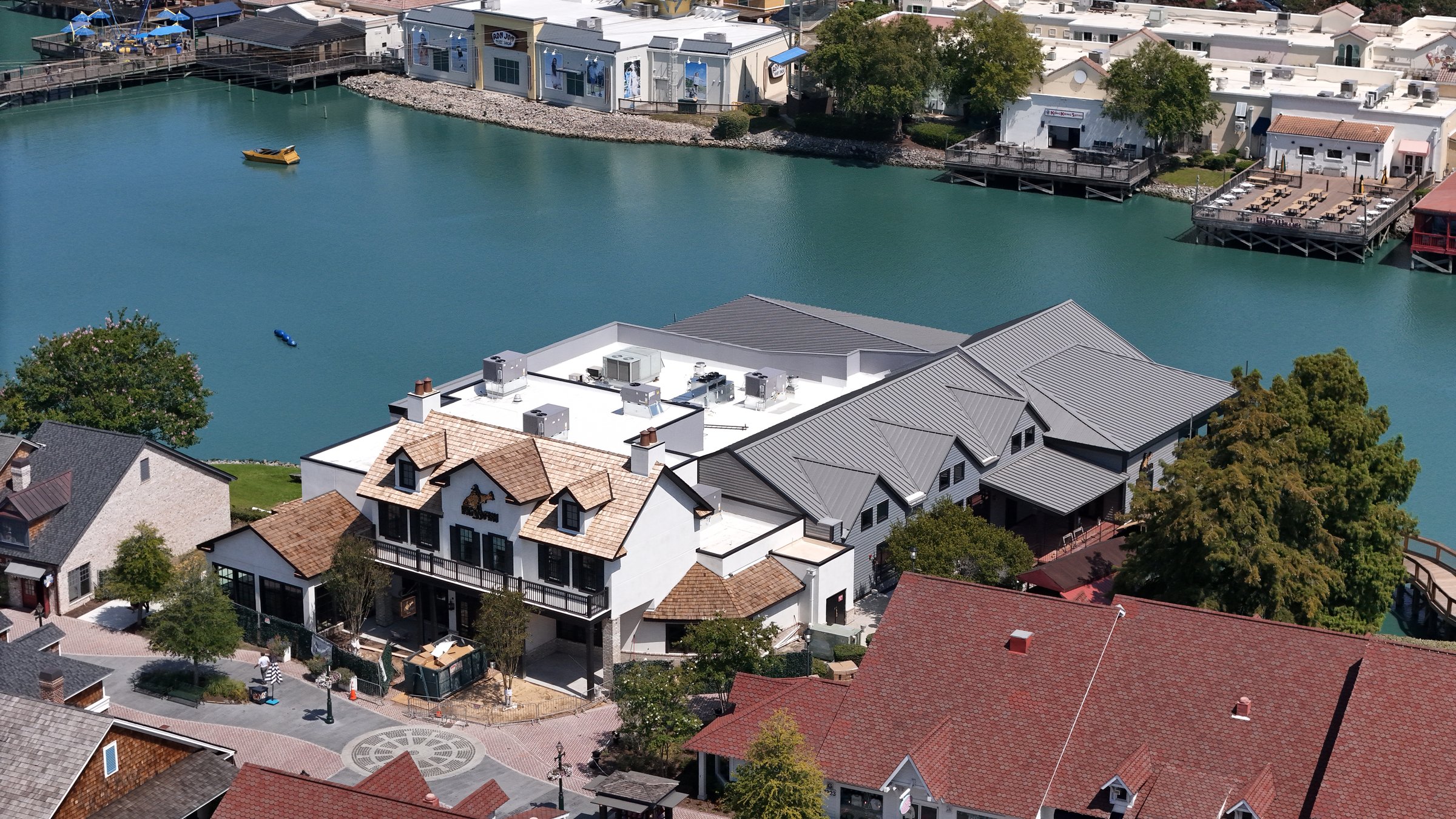 A large commercial building with a white membrane roof.