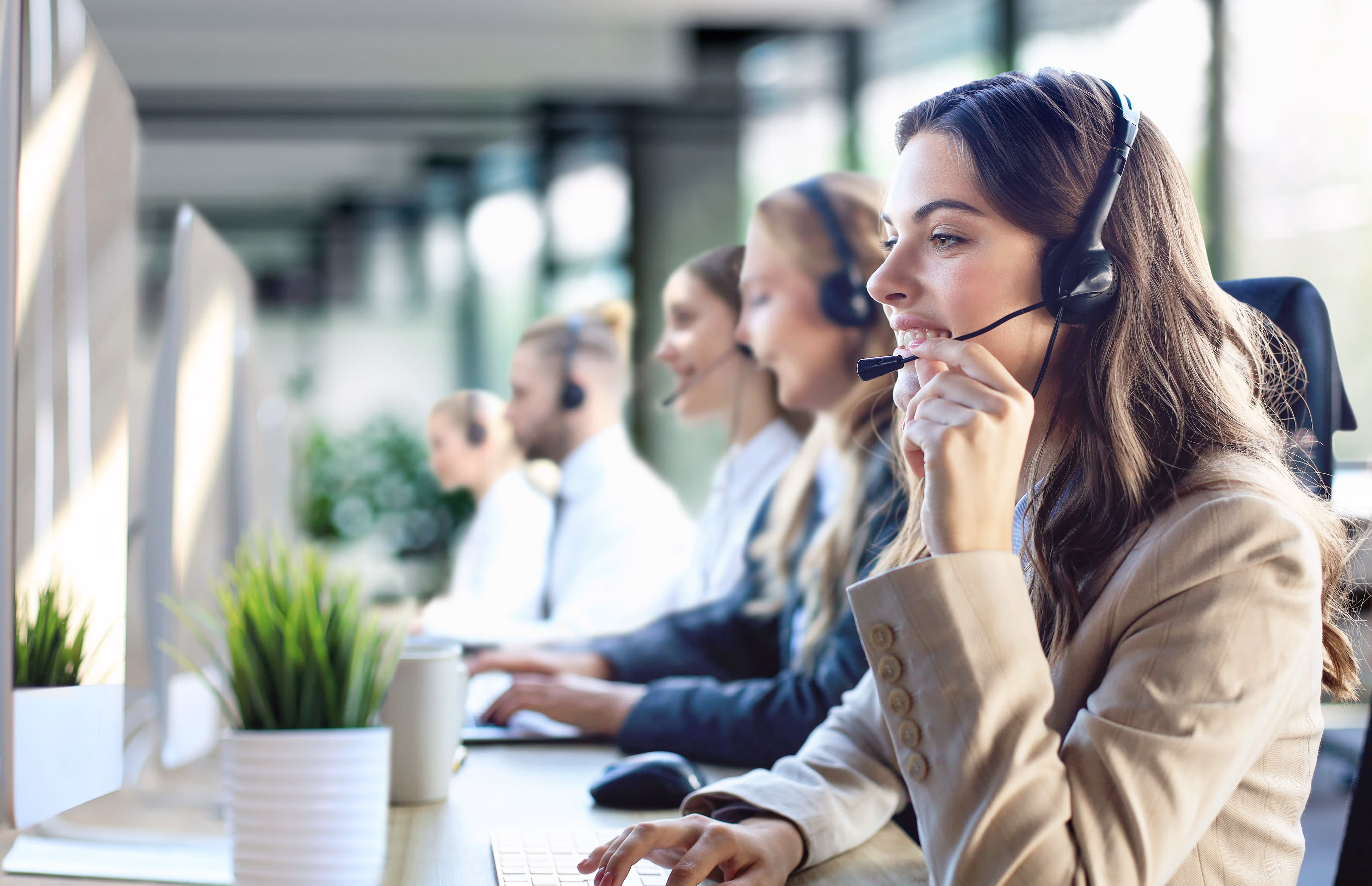 Illustration showing call centers enhancing customer focus with friendly agents, support tools, and efficient communication channels.