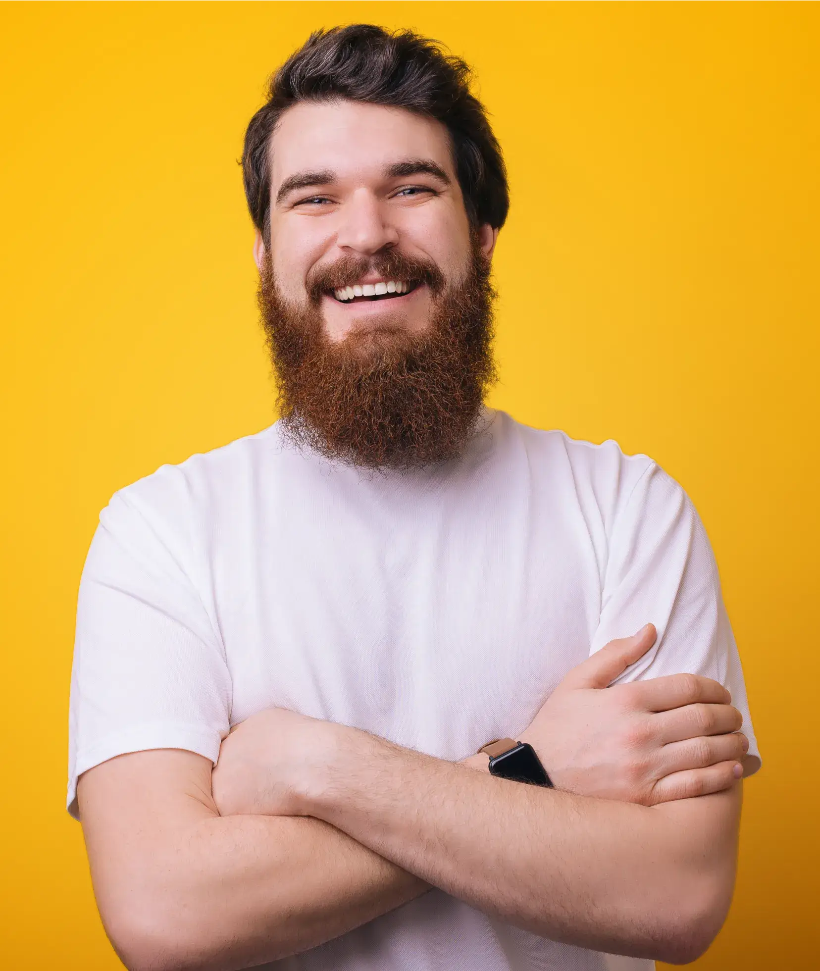 A man with a beard and a watch on his wrist.