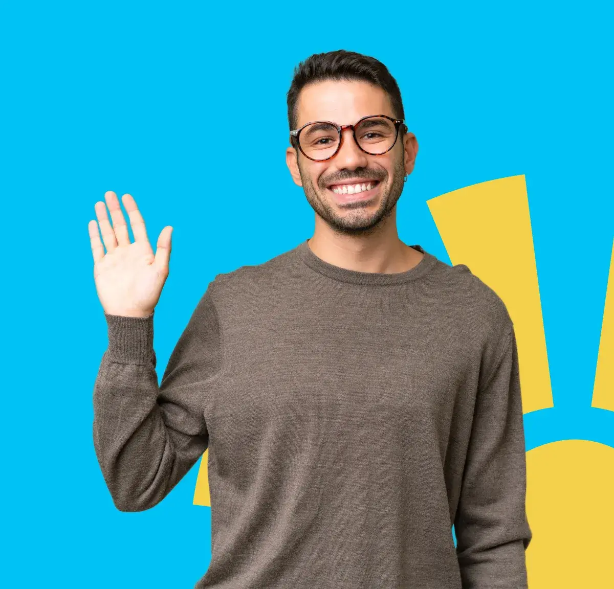 Man smiling and waving with his right hand against a blue background.