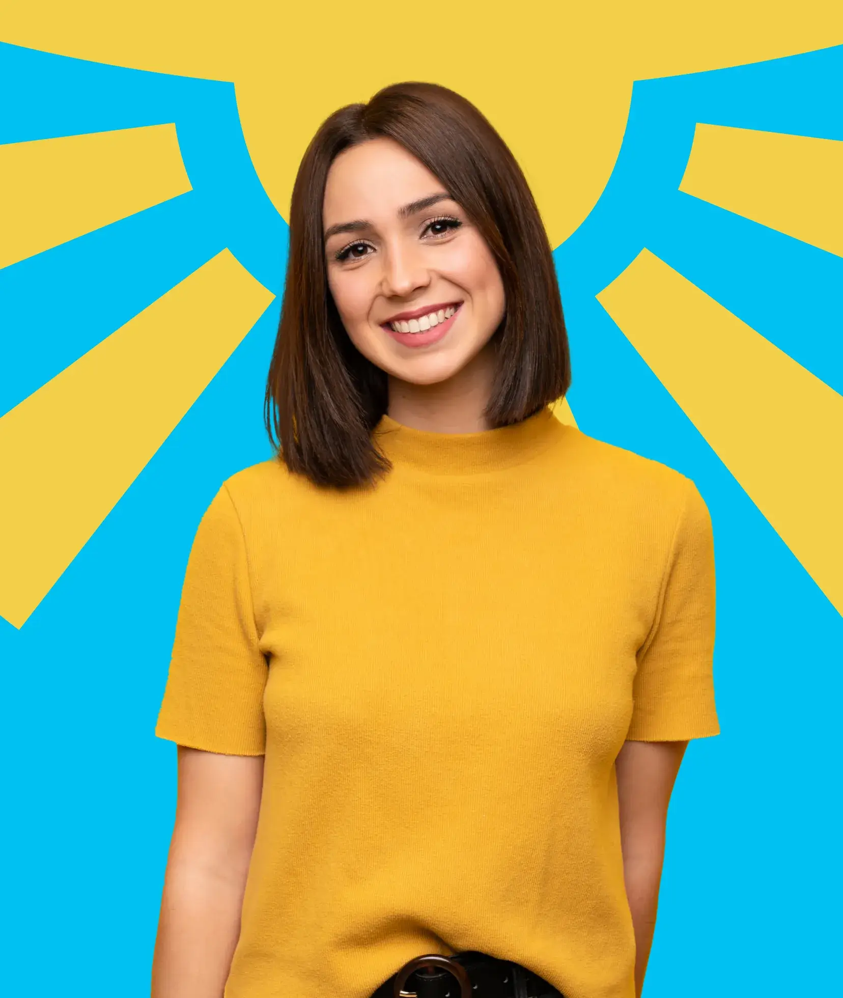 Person smiling, wearing a yellow shirt, standing in front of a colorful, abstract background.