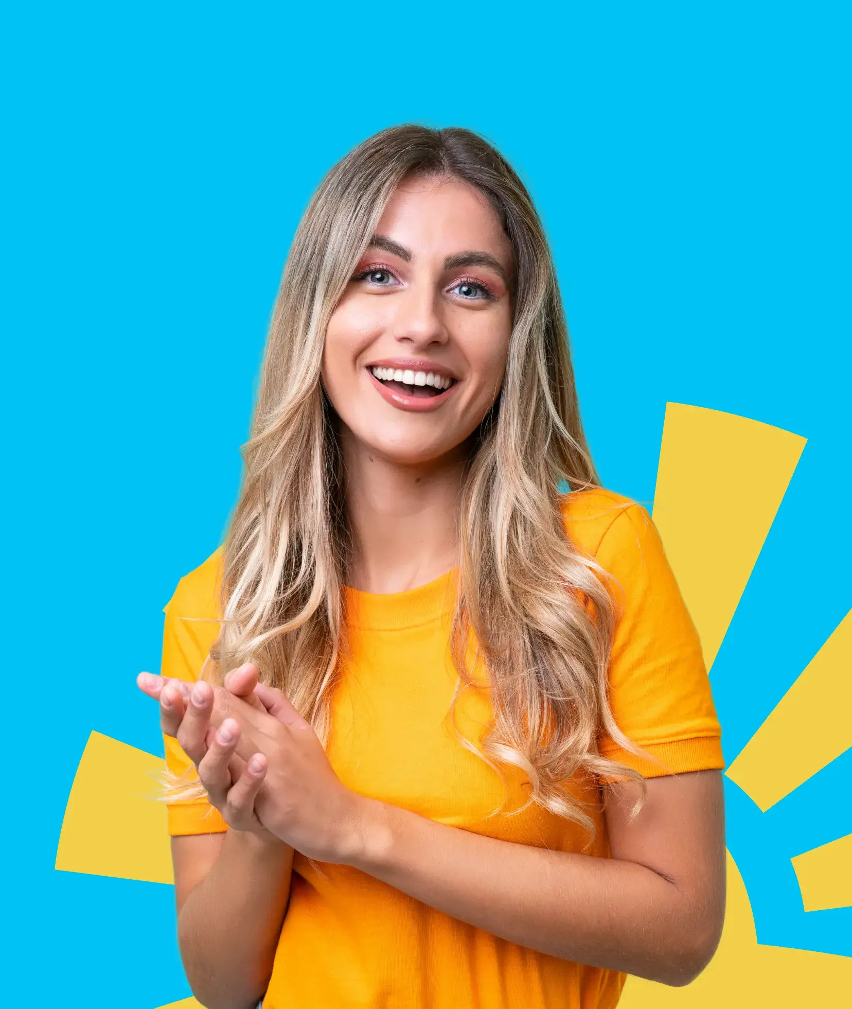 A woman in a yellow shirt smiles and claps against a bright blue background.