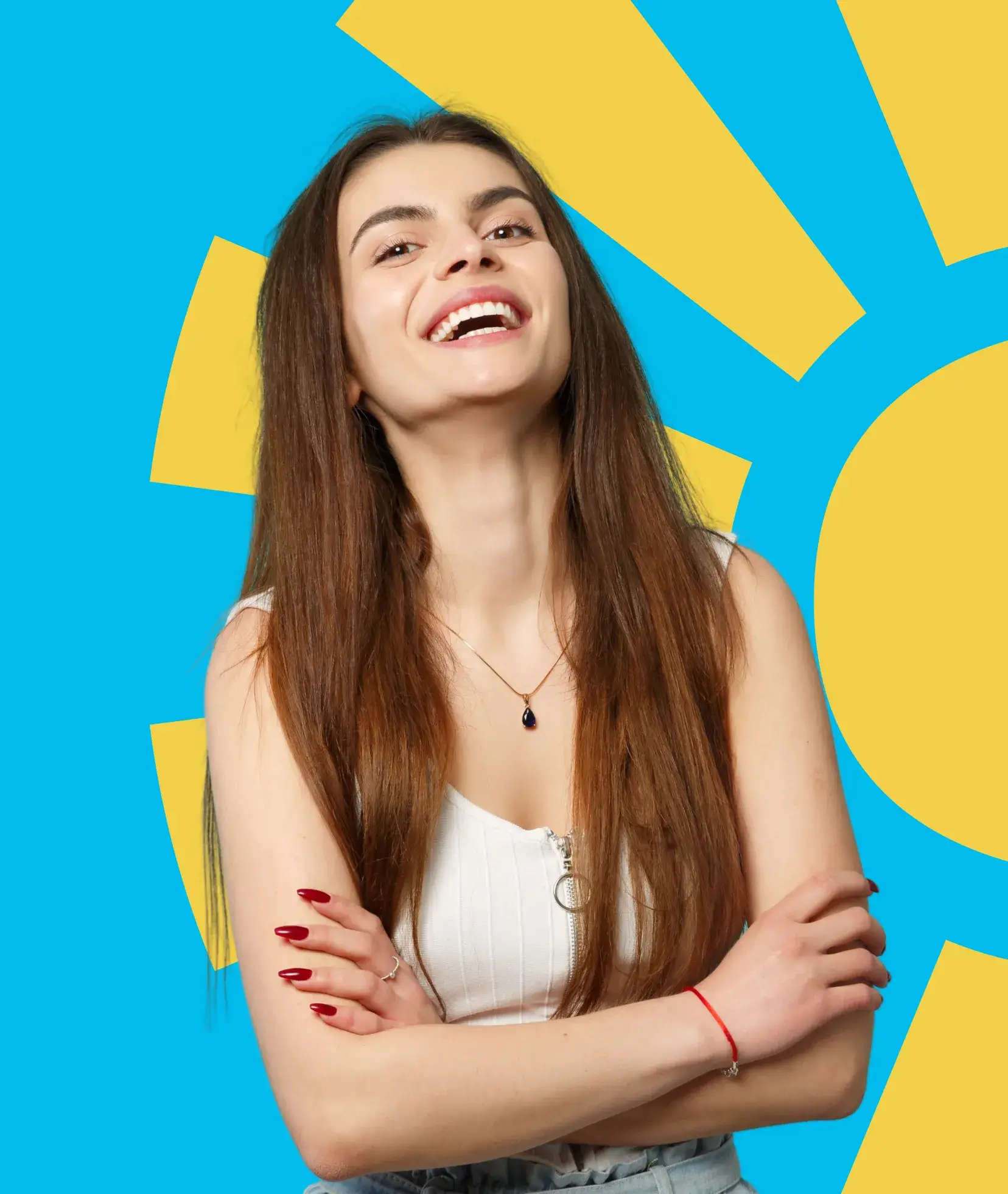 A woman with long hair smiles broadly, standing against a bright blue and yellow background.