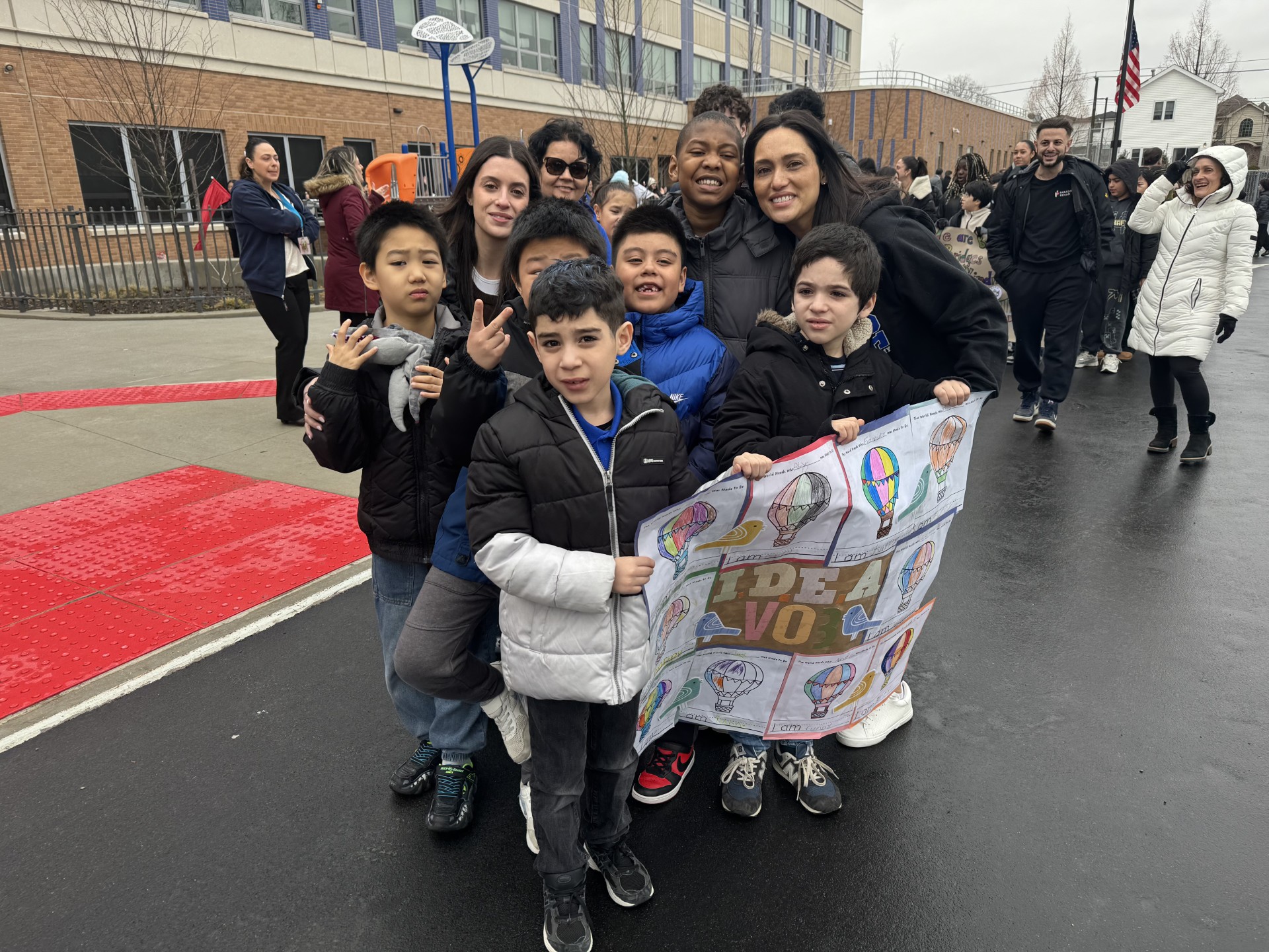 Kids with teacher on road