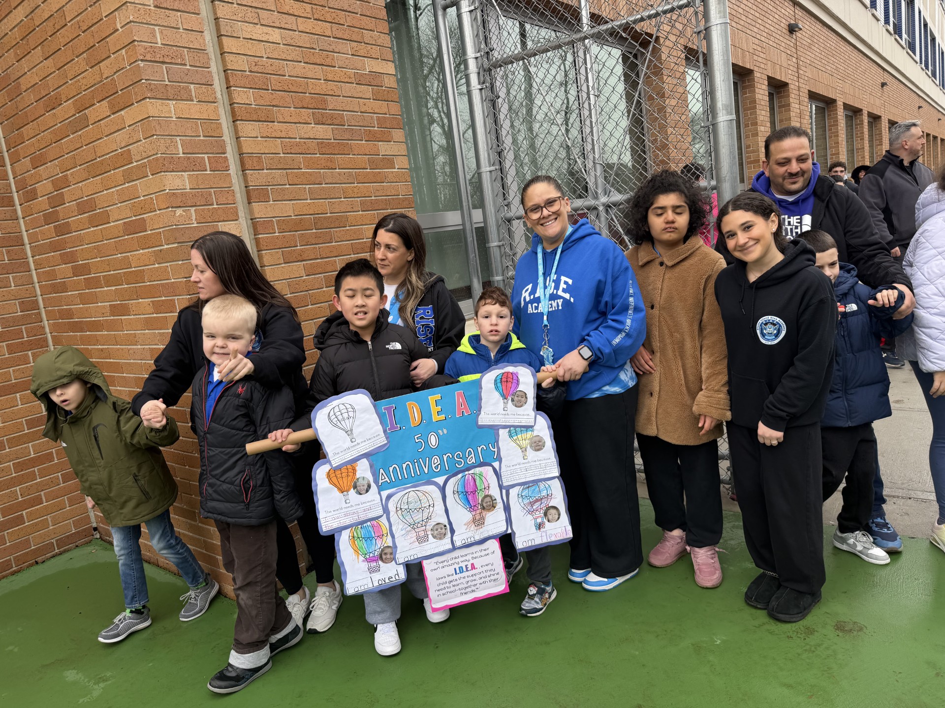 Kids with teacher on road