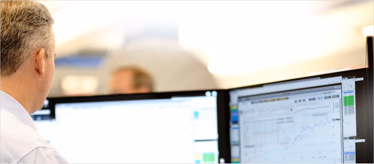 William O'Neil Securities trader looking at his terminal.