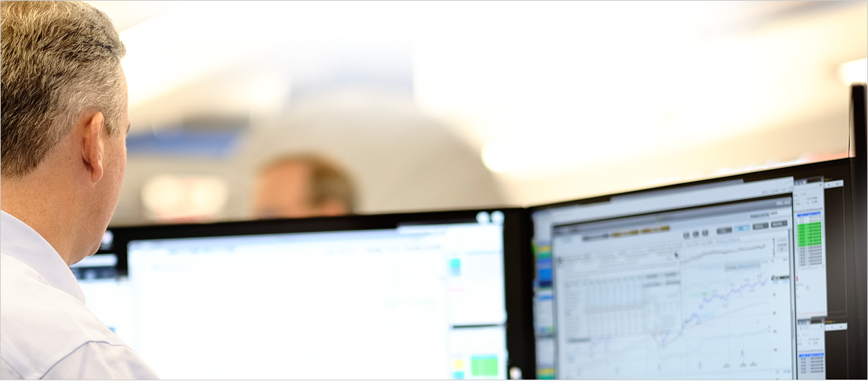 photo of a man looking at computer screen