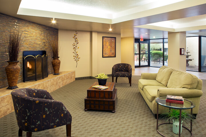 Shared lounge with a fireplace — view 1 at LifeStream at Glendale.