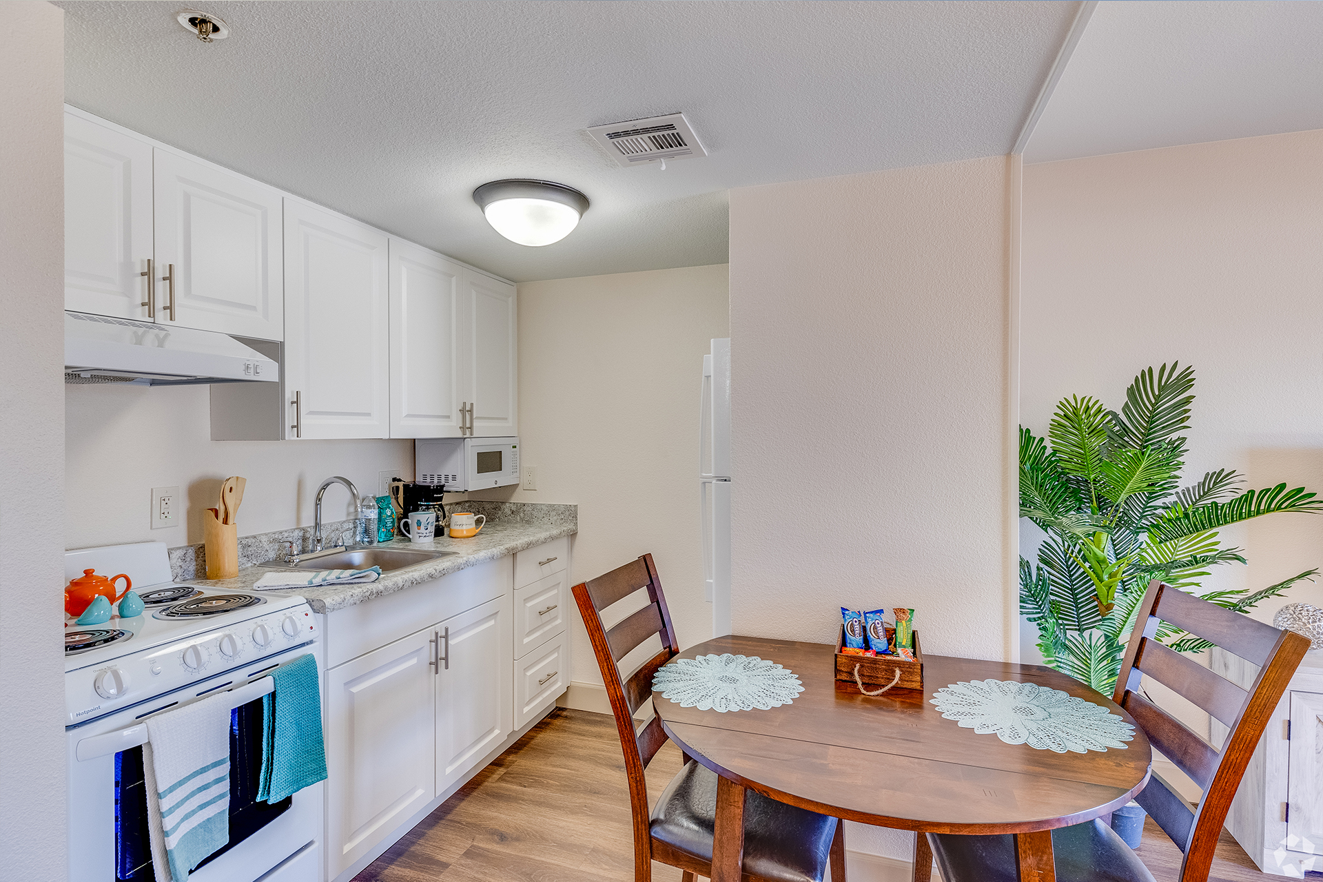 Apartment kitchenette and small dining area — view 1 at LifeStream at Glendale.