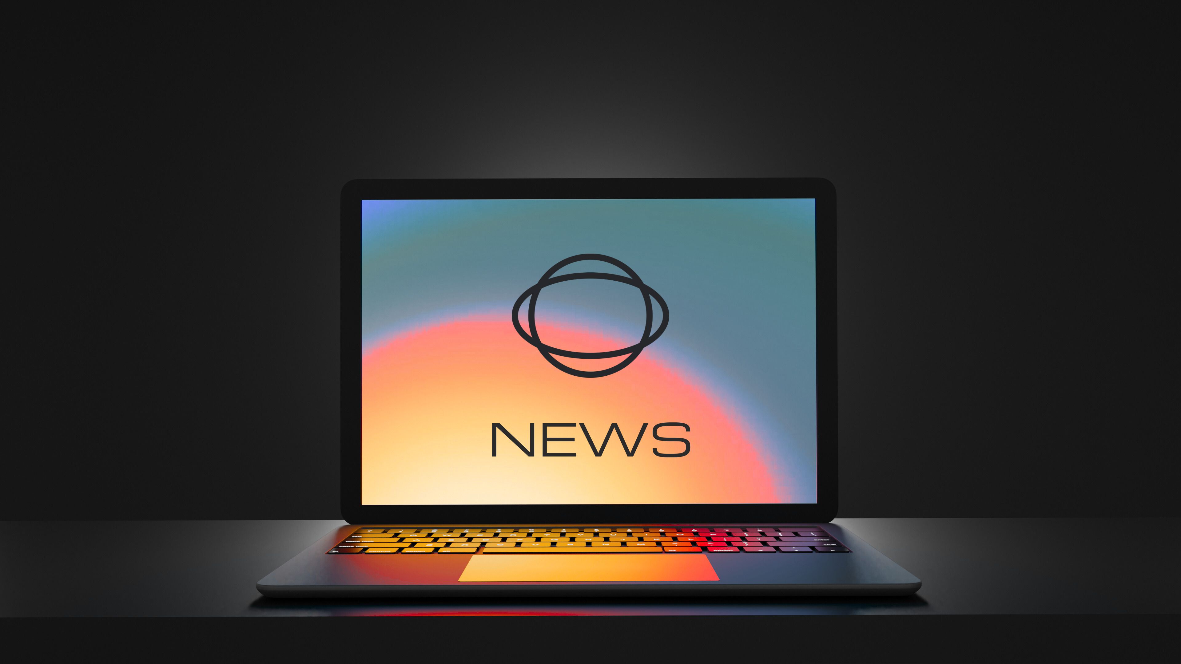 laptop screen showing The Planet Group logo and the text News