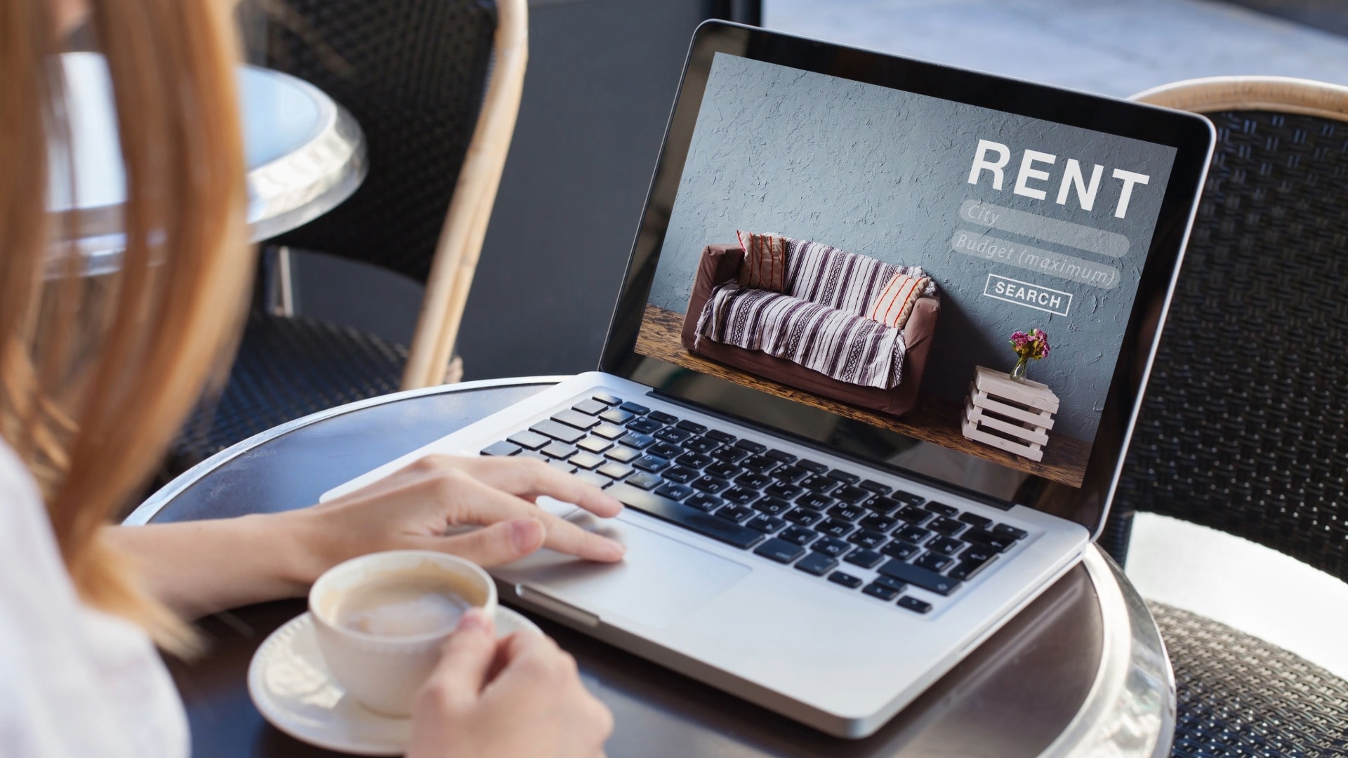 Woman looking at rental or rent reporting site on a laptop