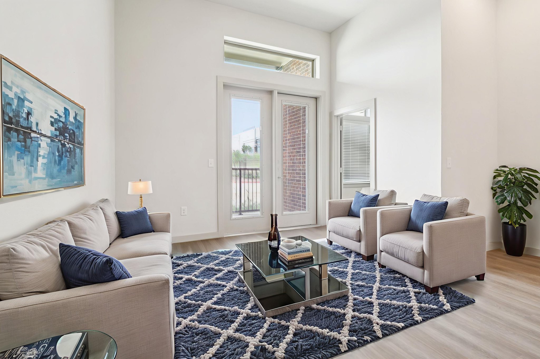 Living area with rug, coffee table, and sofas