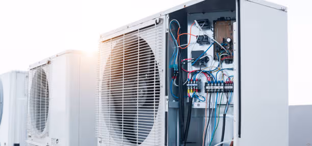 Air conditioning unit with open panel showing electrical wiring and components