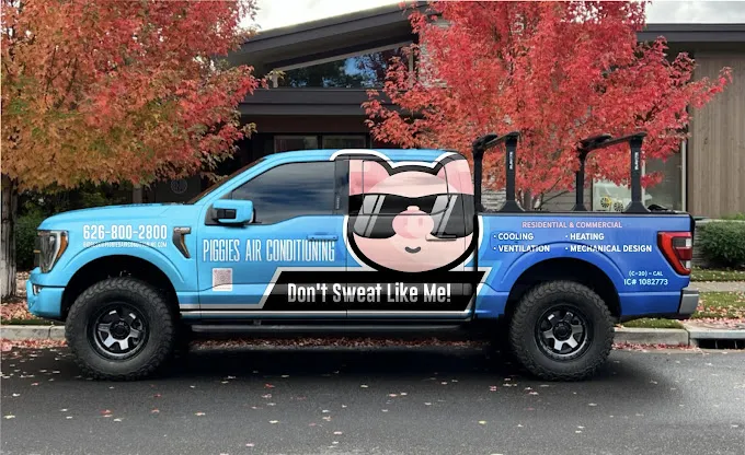 Blue truck with cool pig mascot for Piggies Air Conditioning business