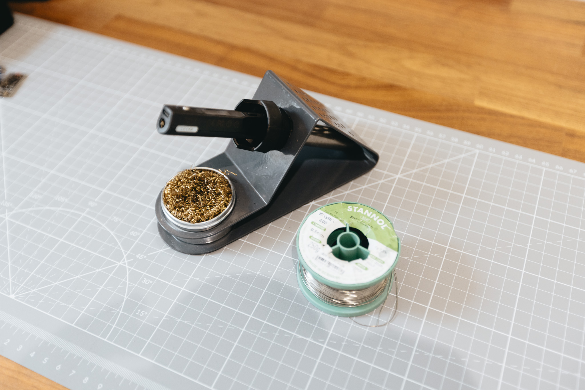 Soldering iron, solder, and tools prepared for assembling a MinimalPad