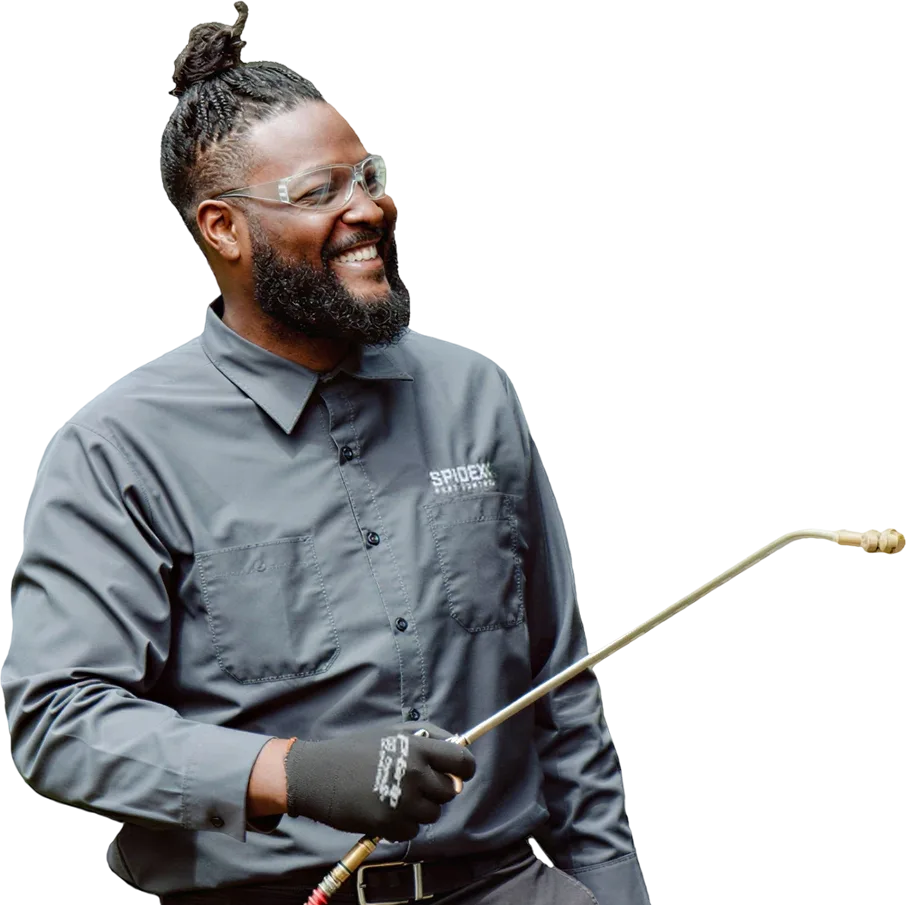 Spidexx technician holding a sprayer