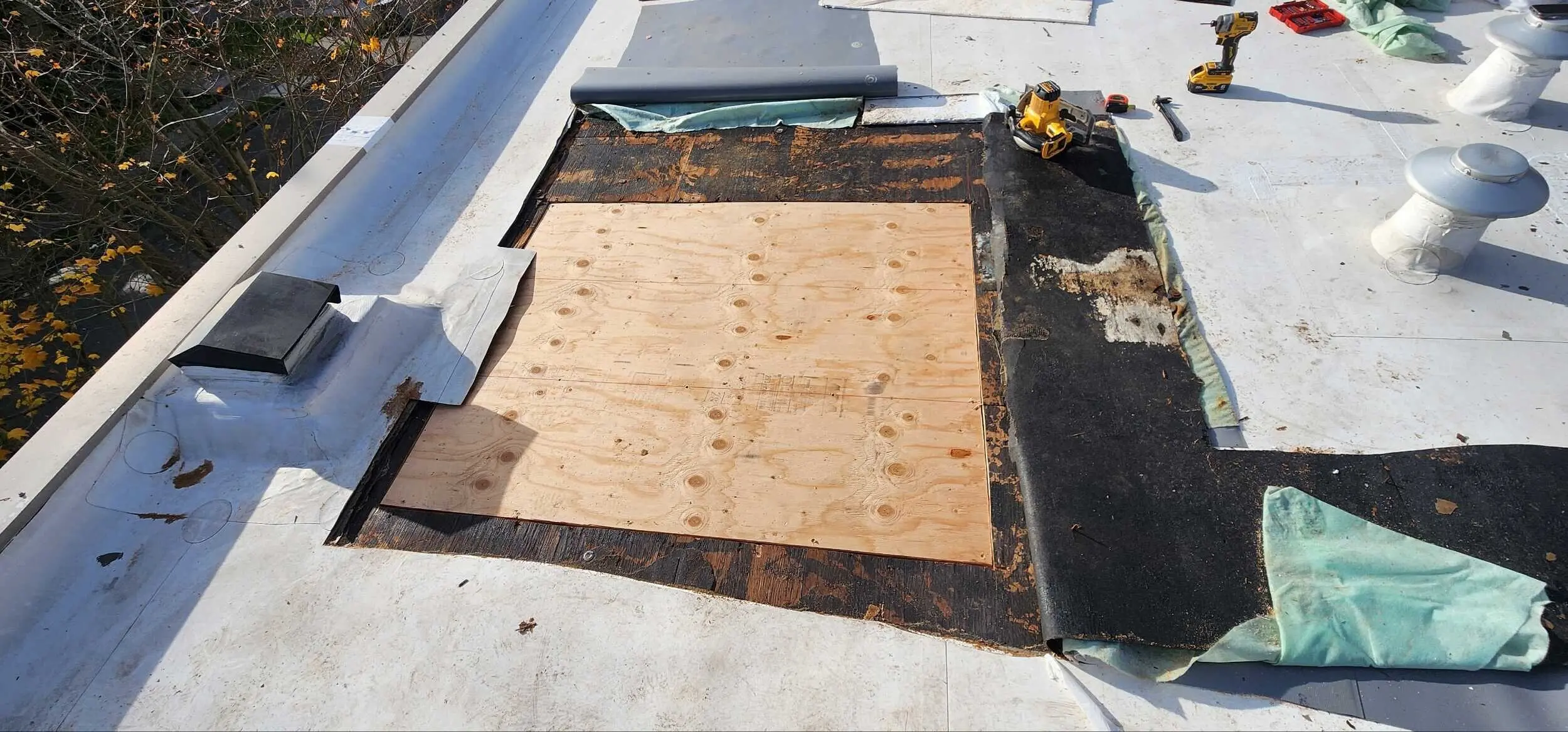 Wood Components being replaced on flat roof by Flat Roof Pros.
