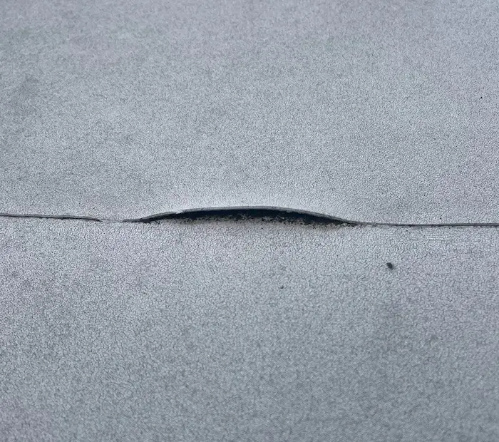 Open seam on flat roof.