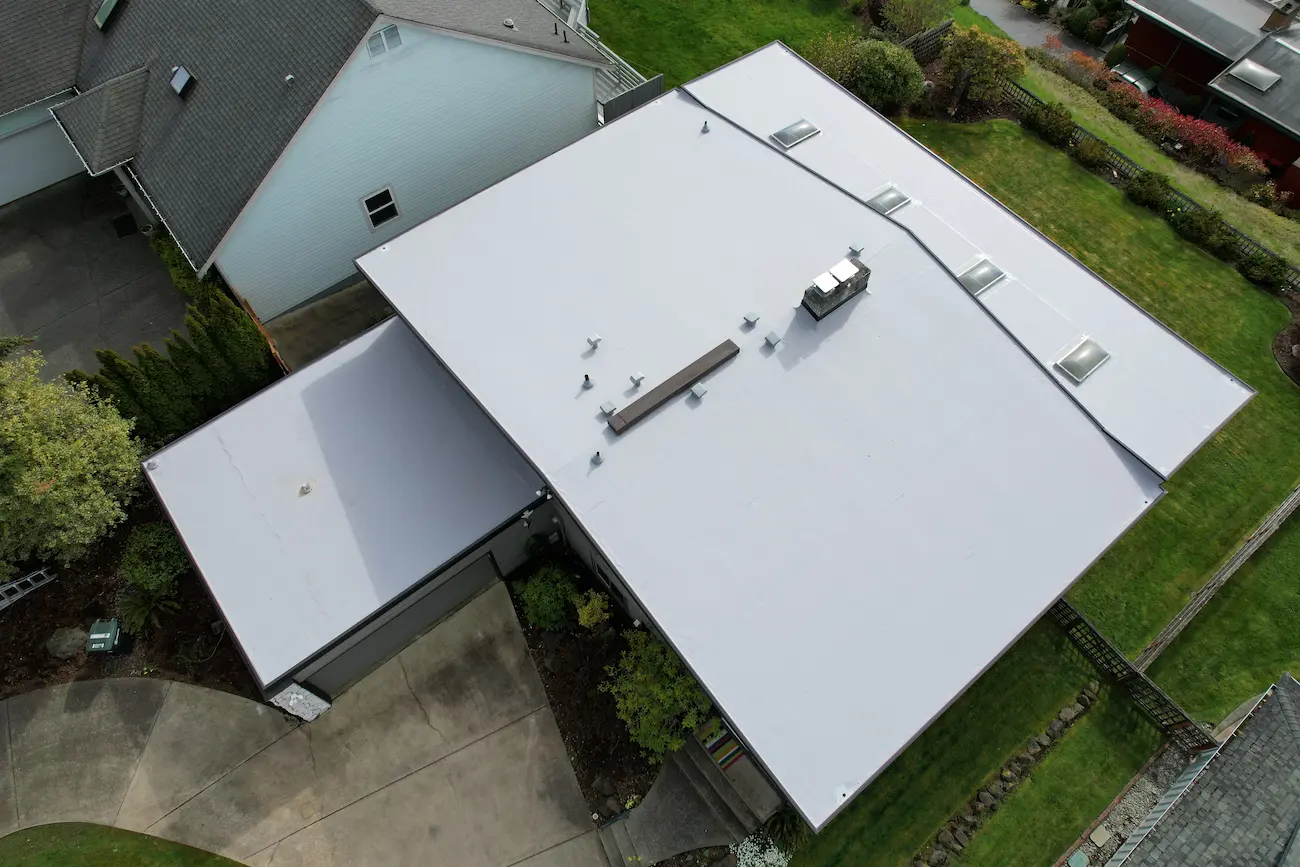 Completed residential TPO roof system featuring reinforced seams and updated penetrations for long-term durability