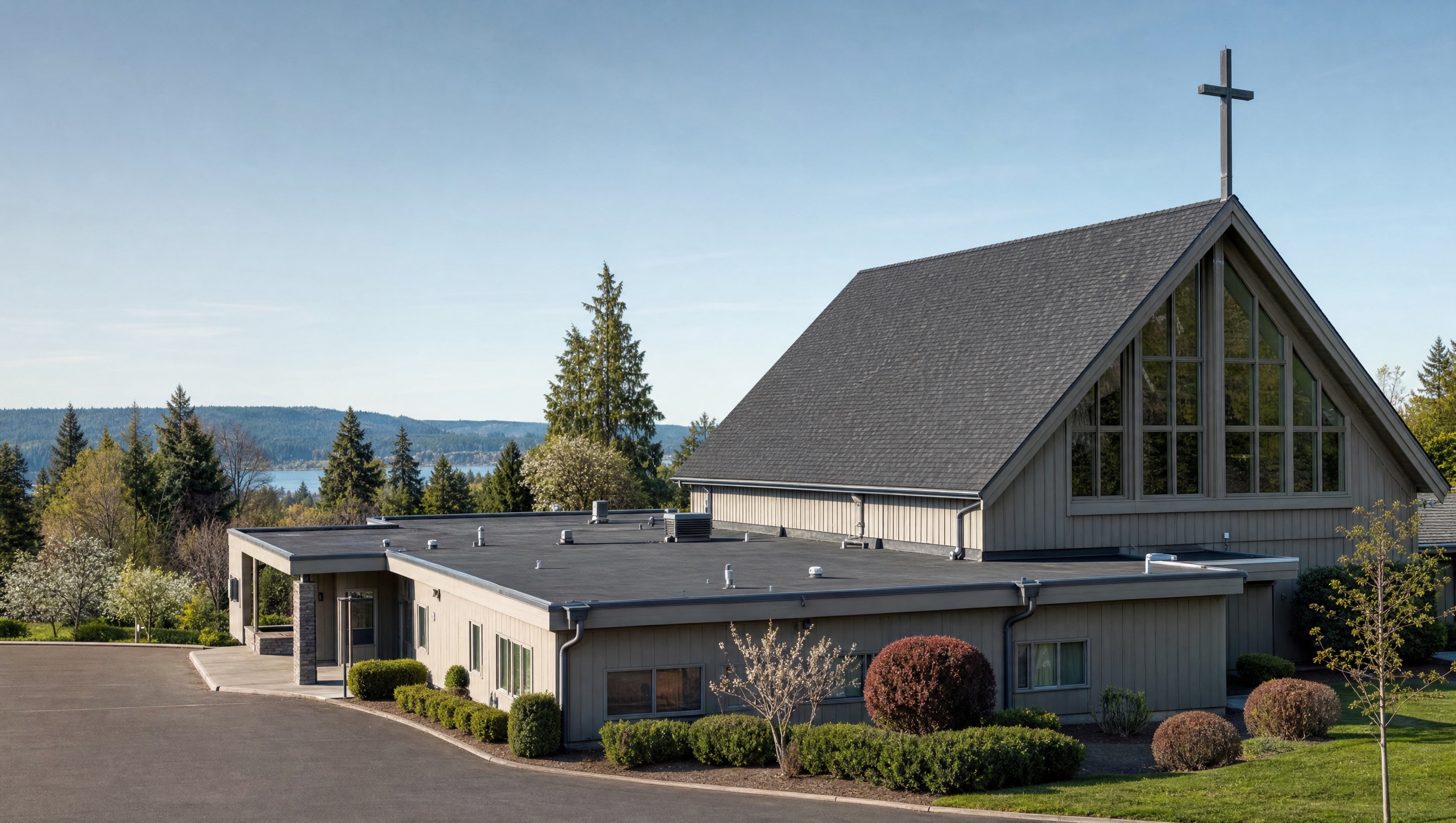 Christian church property in Washington with visible pitched and low-slope roof areas