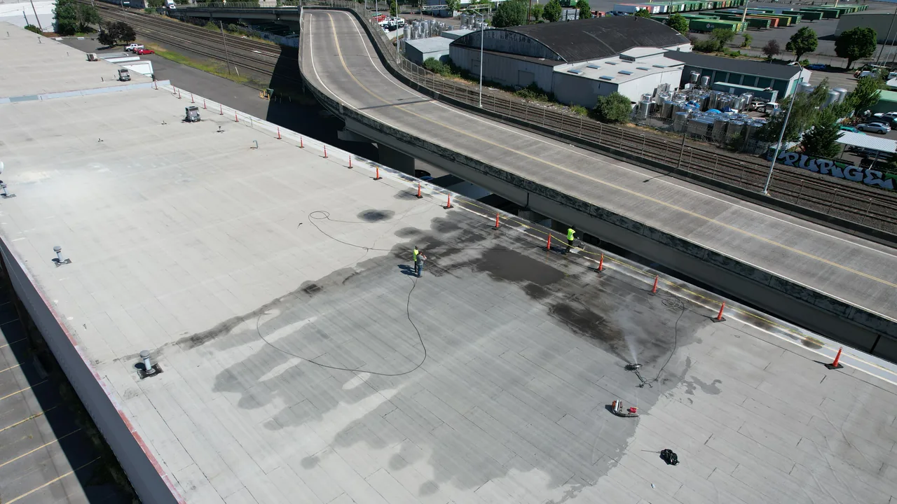 Commercial roof replacement in progress with work areas, materials, and scope boundaries visible.