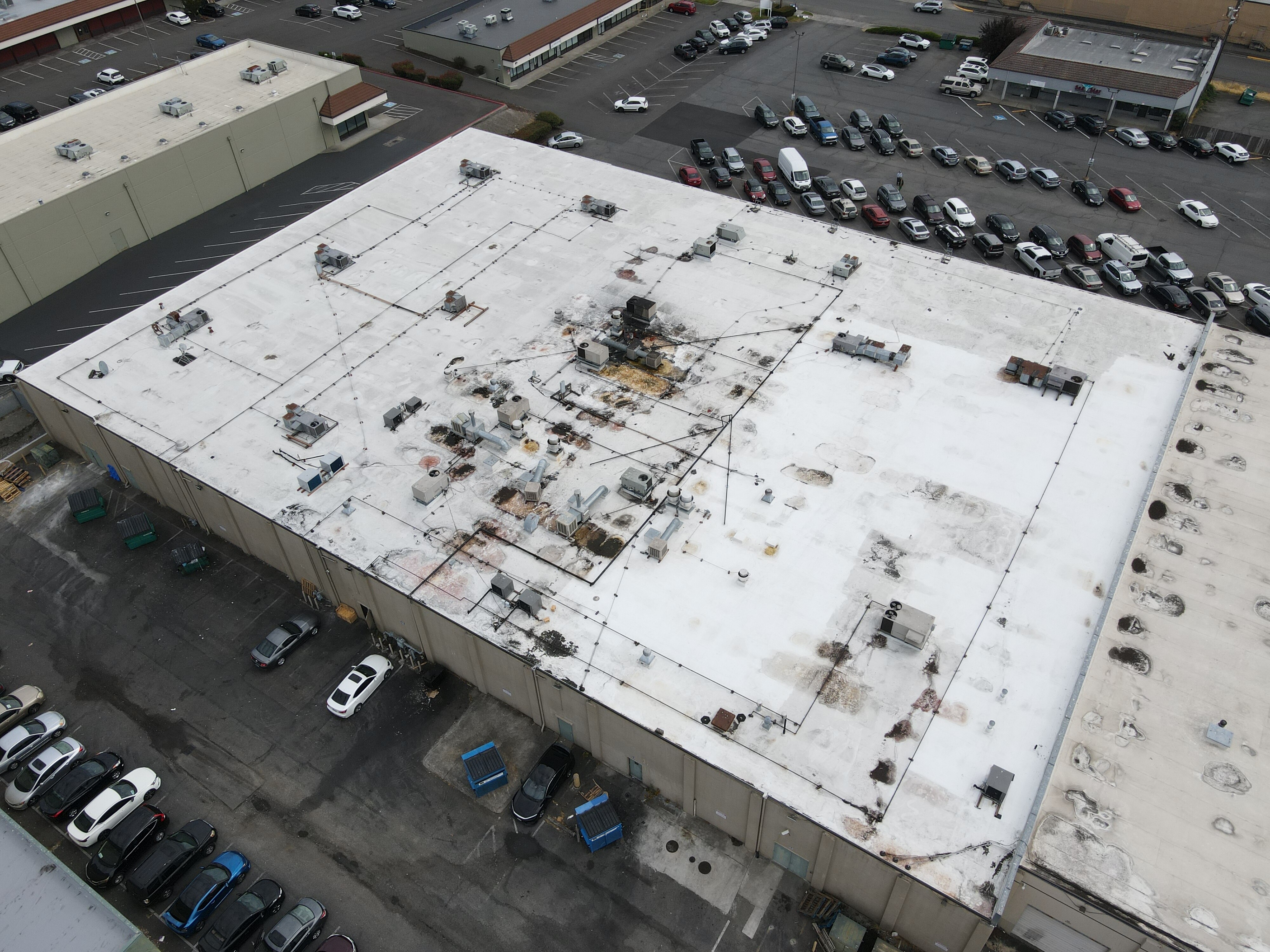 Commercial roof insulation and cover board installation during a flat roof replacement