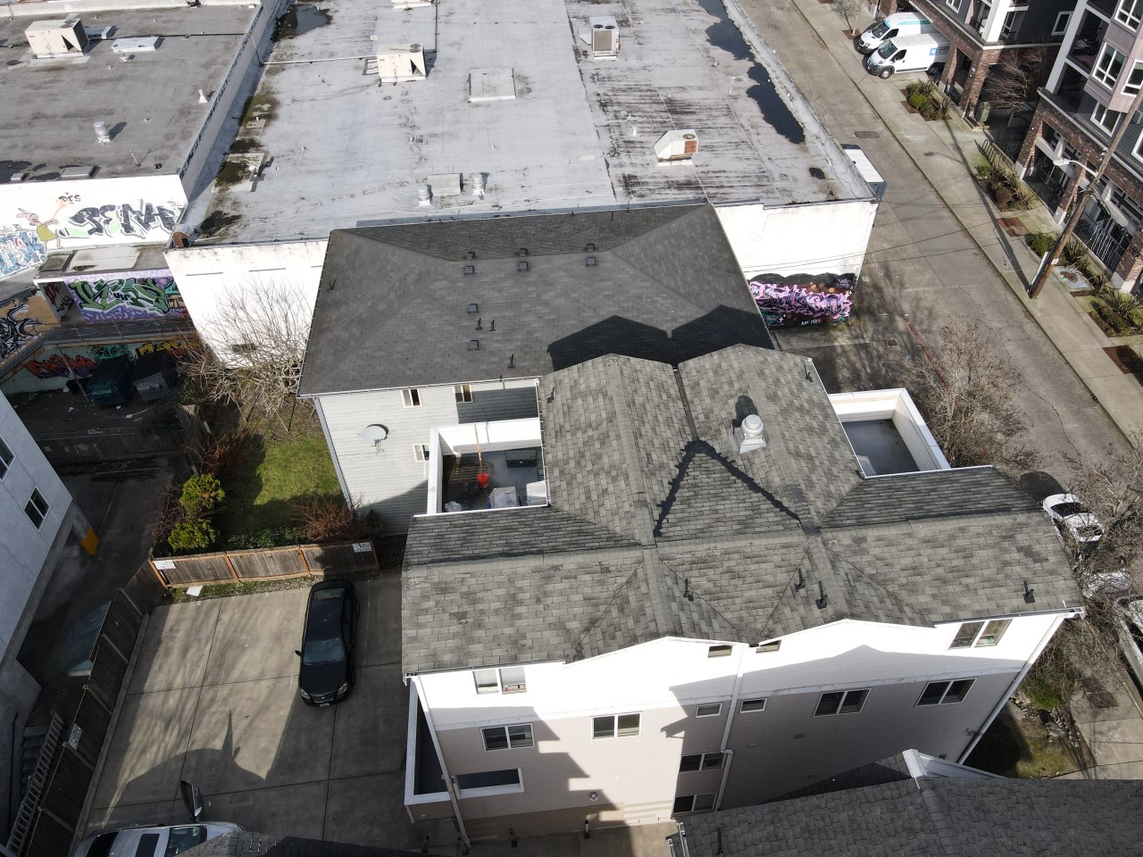 HOA board reviewing multi-building roof condition maps, photos, and reserve planning data