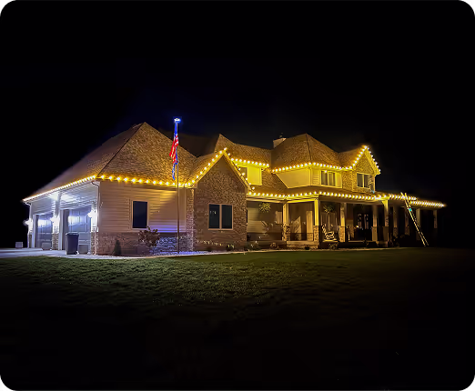 A Toledo home with warm white roofline lights