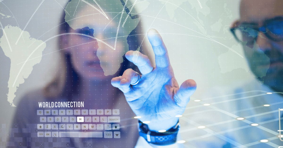 Person interacting with a digital world map overlaid with global network connections.