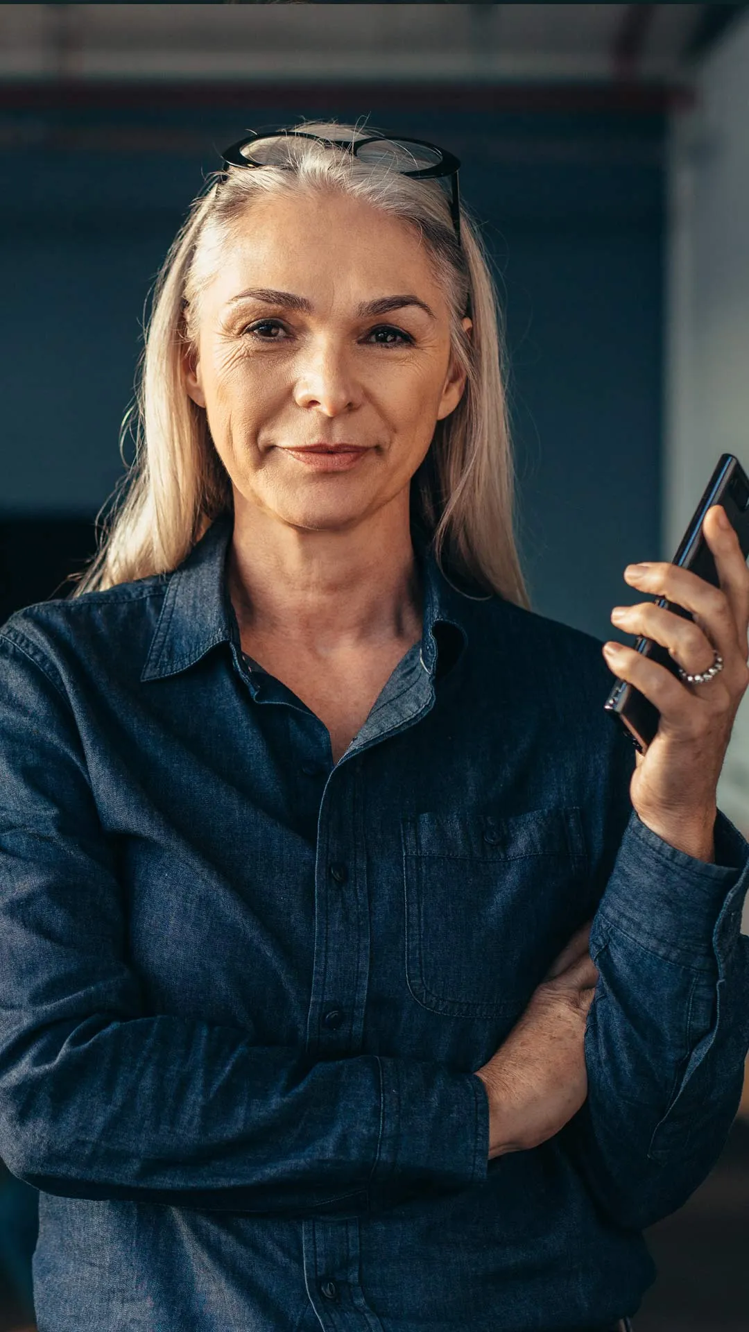 Professional business continuity consultant holding phone