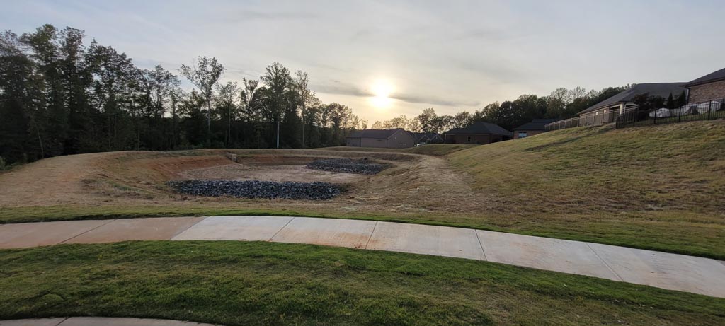 A professionally graded detention pond for a neighborhood.