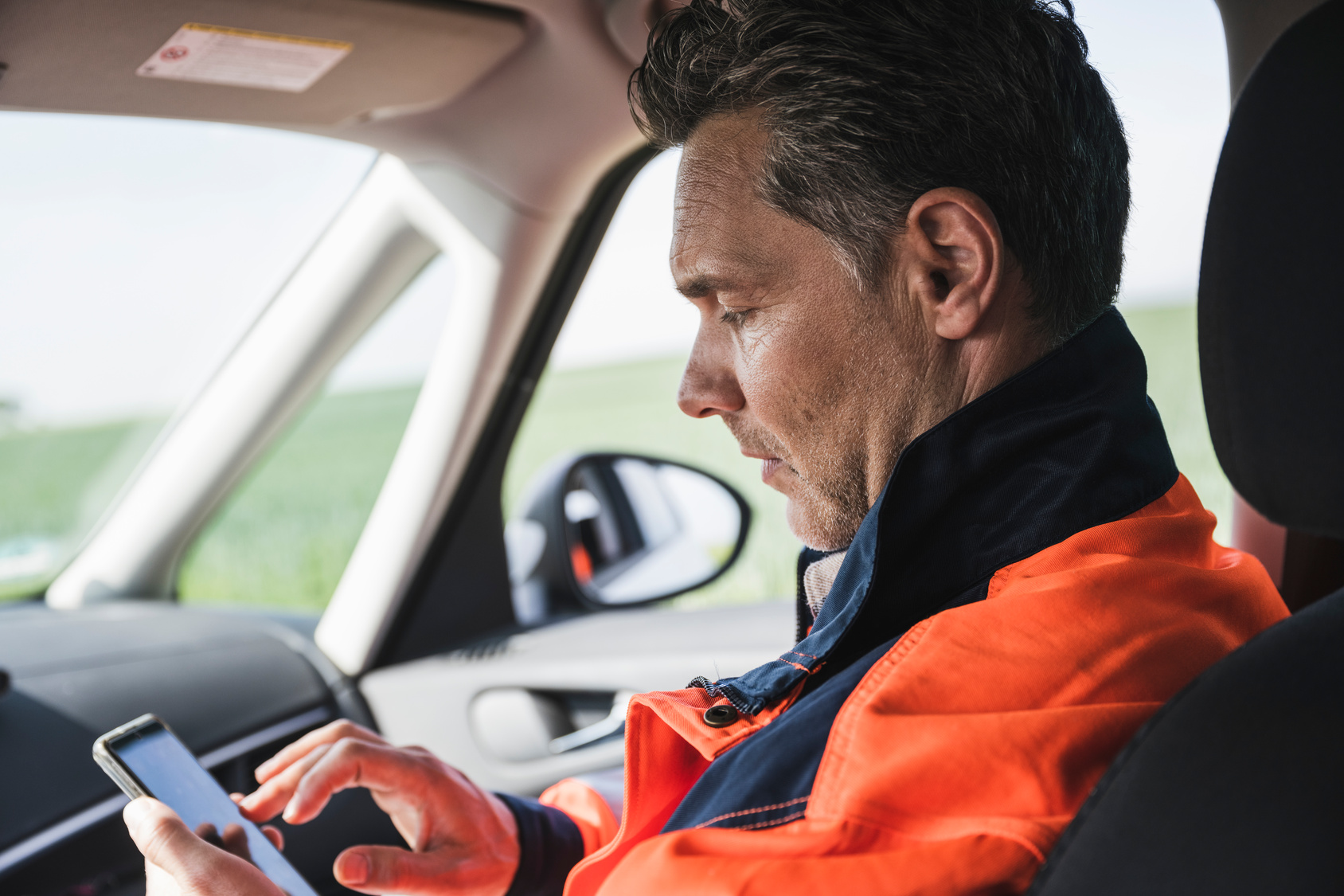 Field engineer using mobile app to view his work schedule for the day